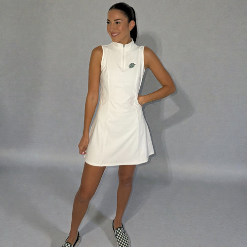 Woman wearing a white sleeveless dress with a logo on a gray background