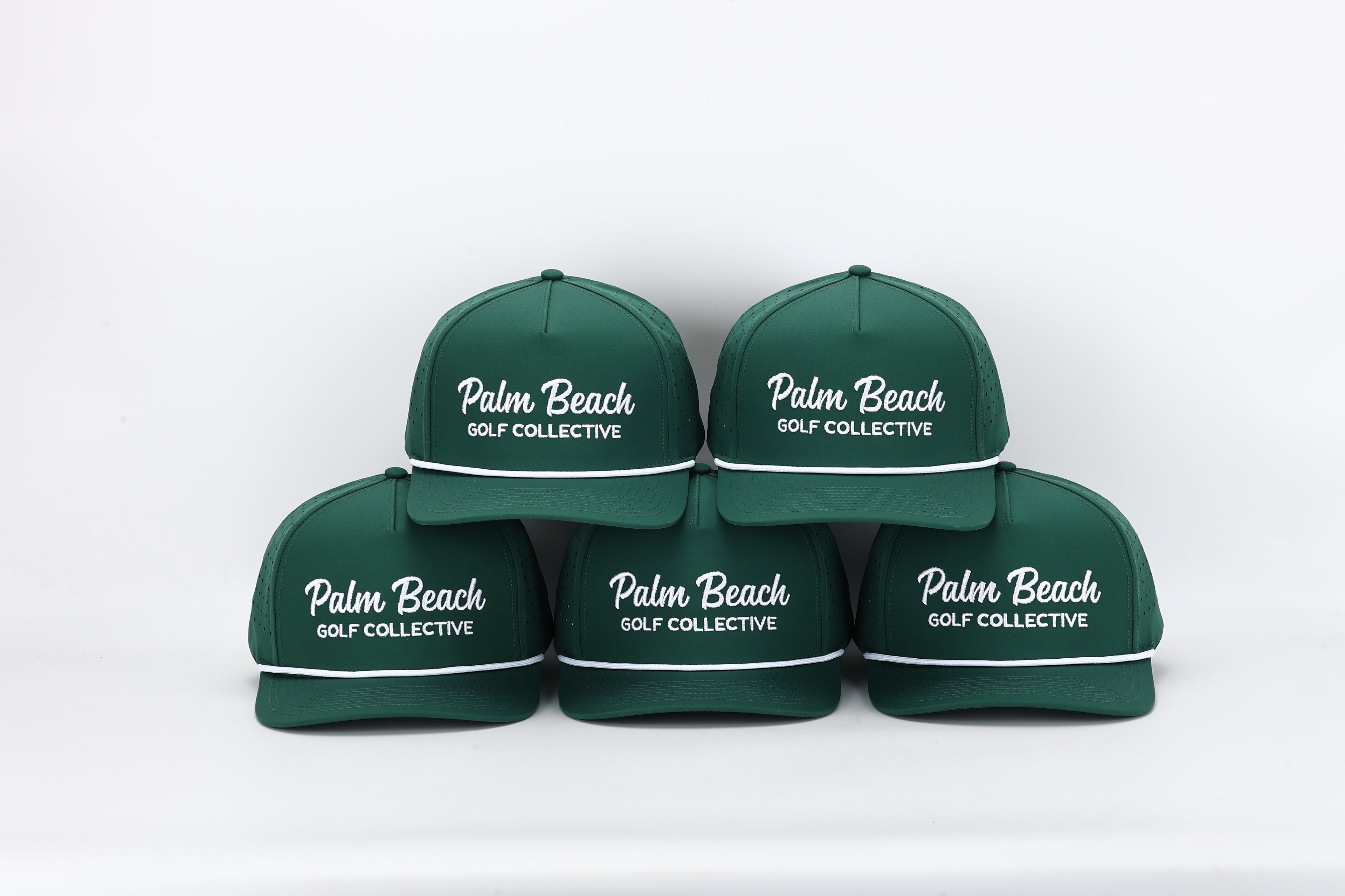 Five green caps with 'Palm Beach Golf Collective' text on a white background