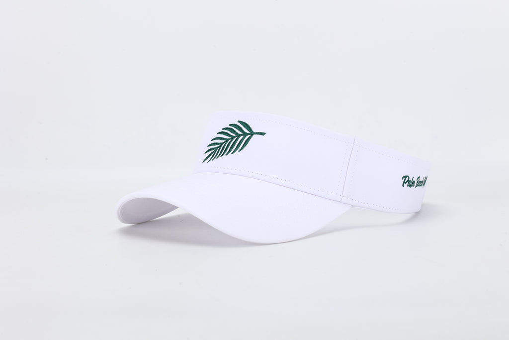 White visor with green leaf logo on a light gray background