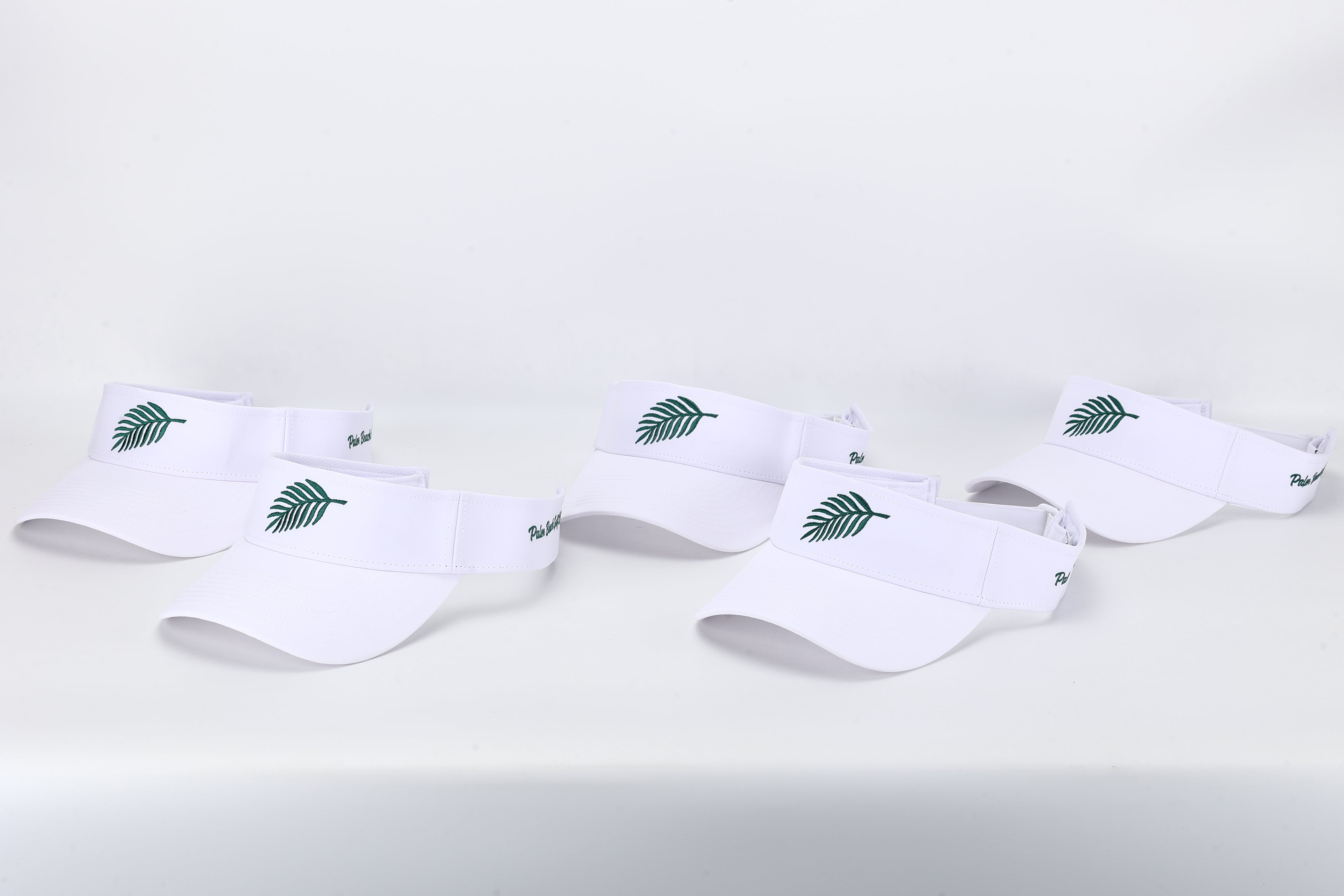 Set of White Visors with Palm Leaf Logo