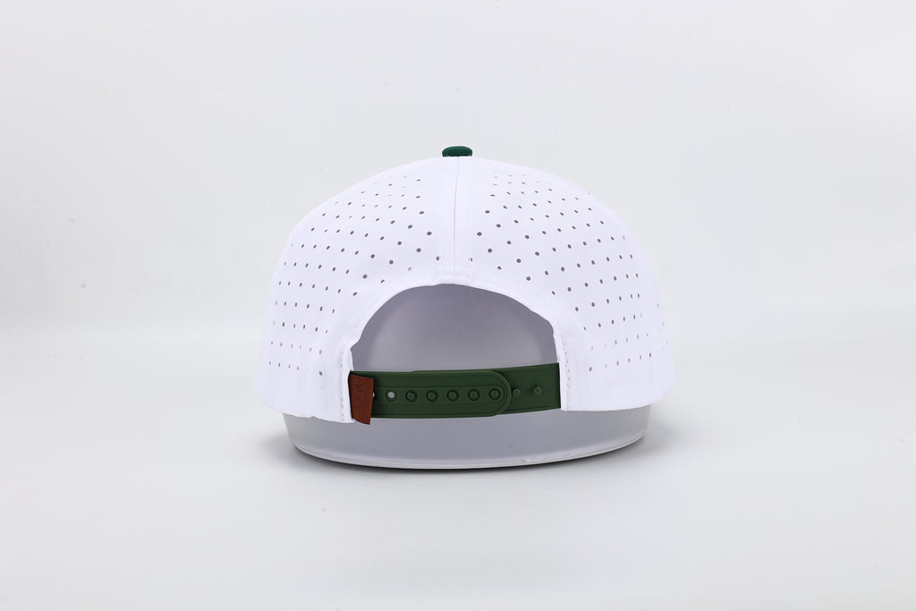 White baseball cap with green brim and logo on a light gray background