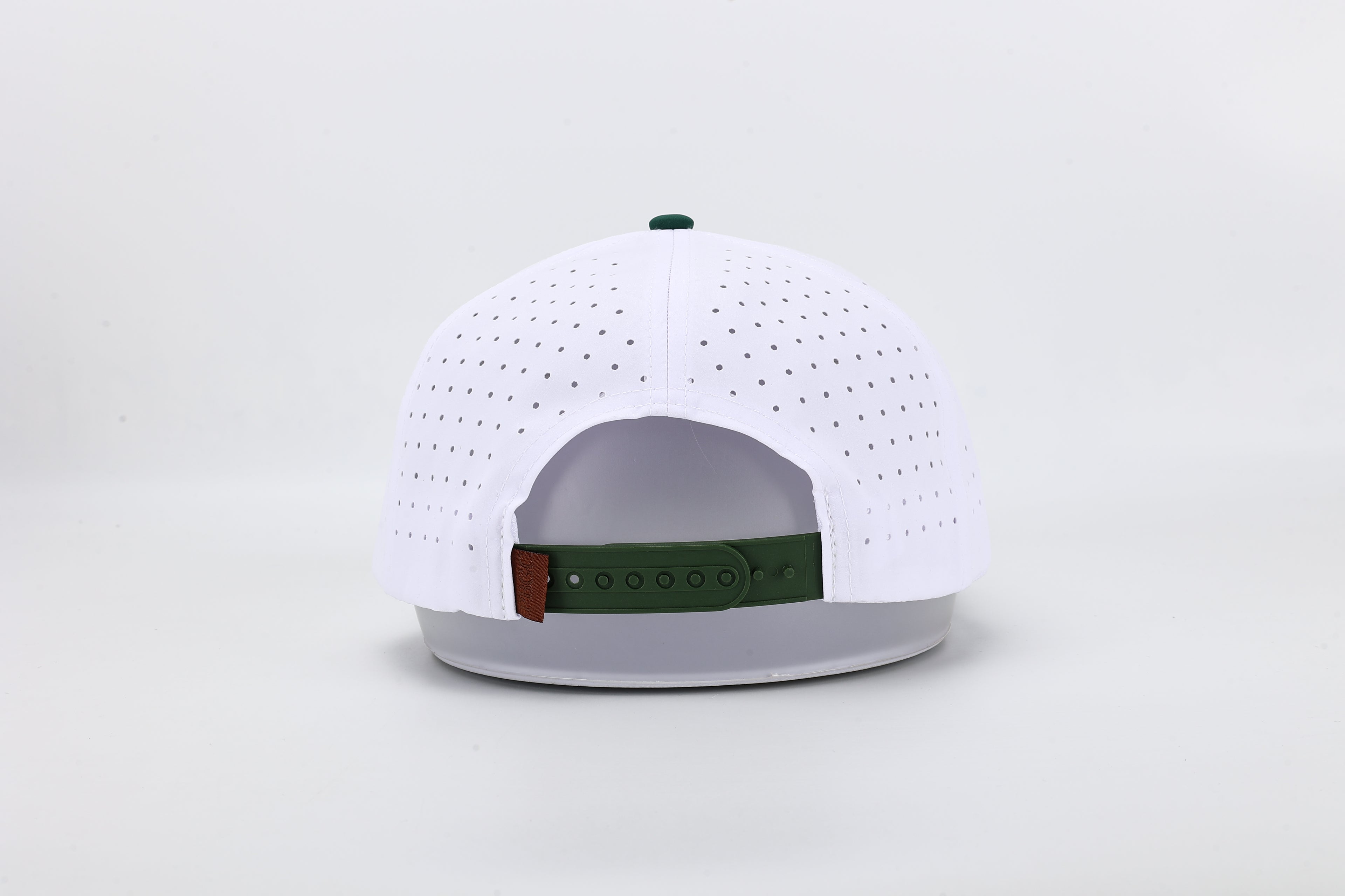 White baseball cap with green brim and logo on a light gray background