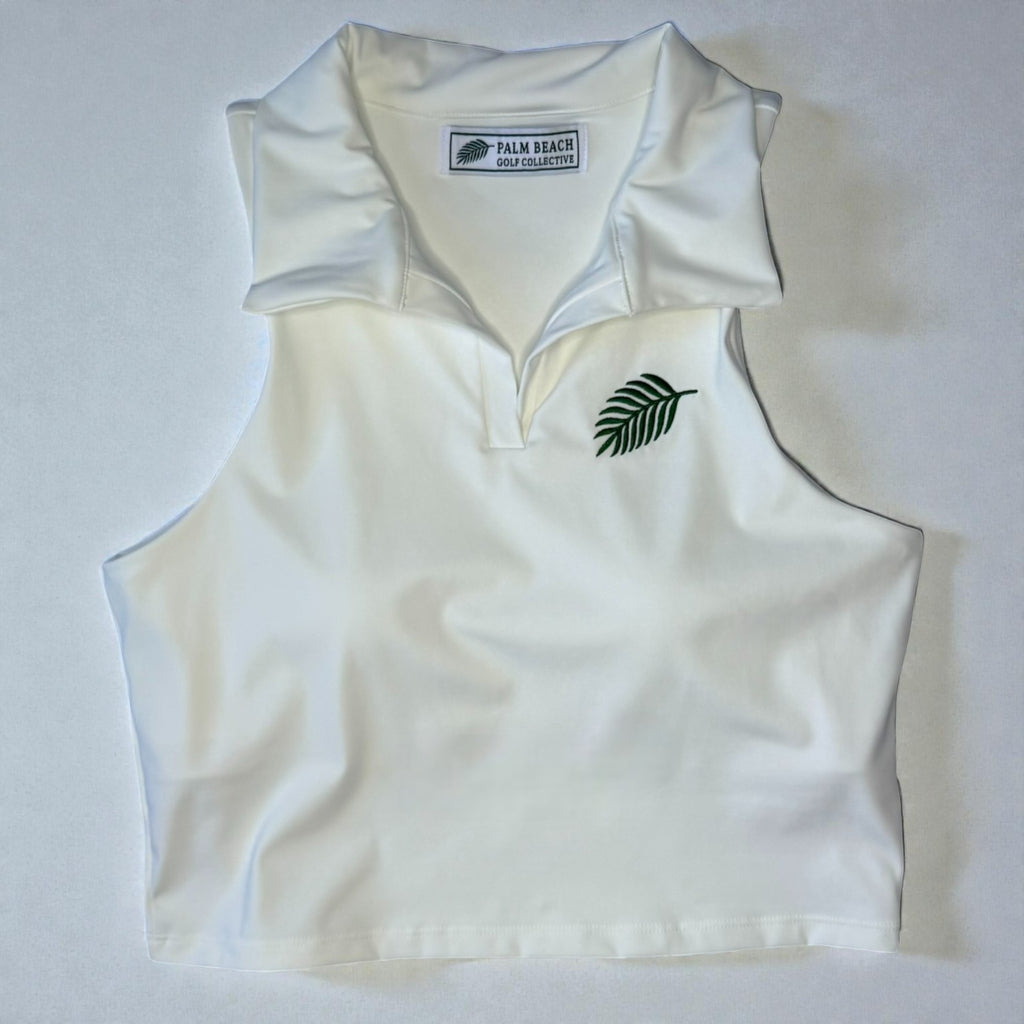 White sleeveless golf top with a logo on a white background