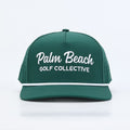 PBGC deep green golf hat with white rope trim and white embroidered Palm Beach Golf Collective logo on front