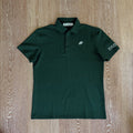 PBGC forest green performance golf polo with a three-button placket, structured collar, and palm leaf chest logo.