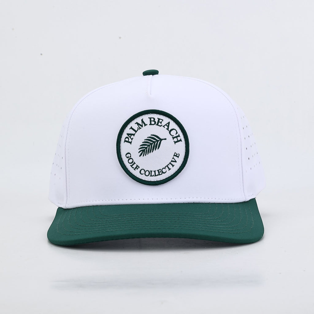 PBGC The Palm Patch Hat featuring a white crown, green bill, and circular embroidered palm tree logo patch.