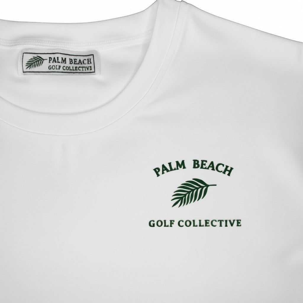 PBGC Clubhouse Crop Top in white with green palm leaf logo and branded neck label