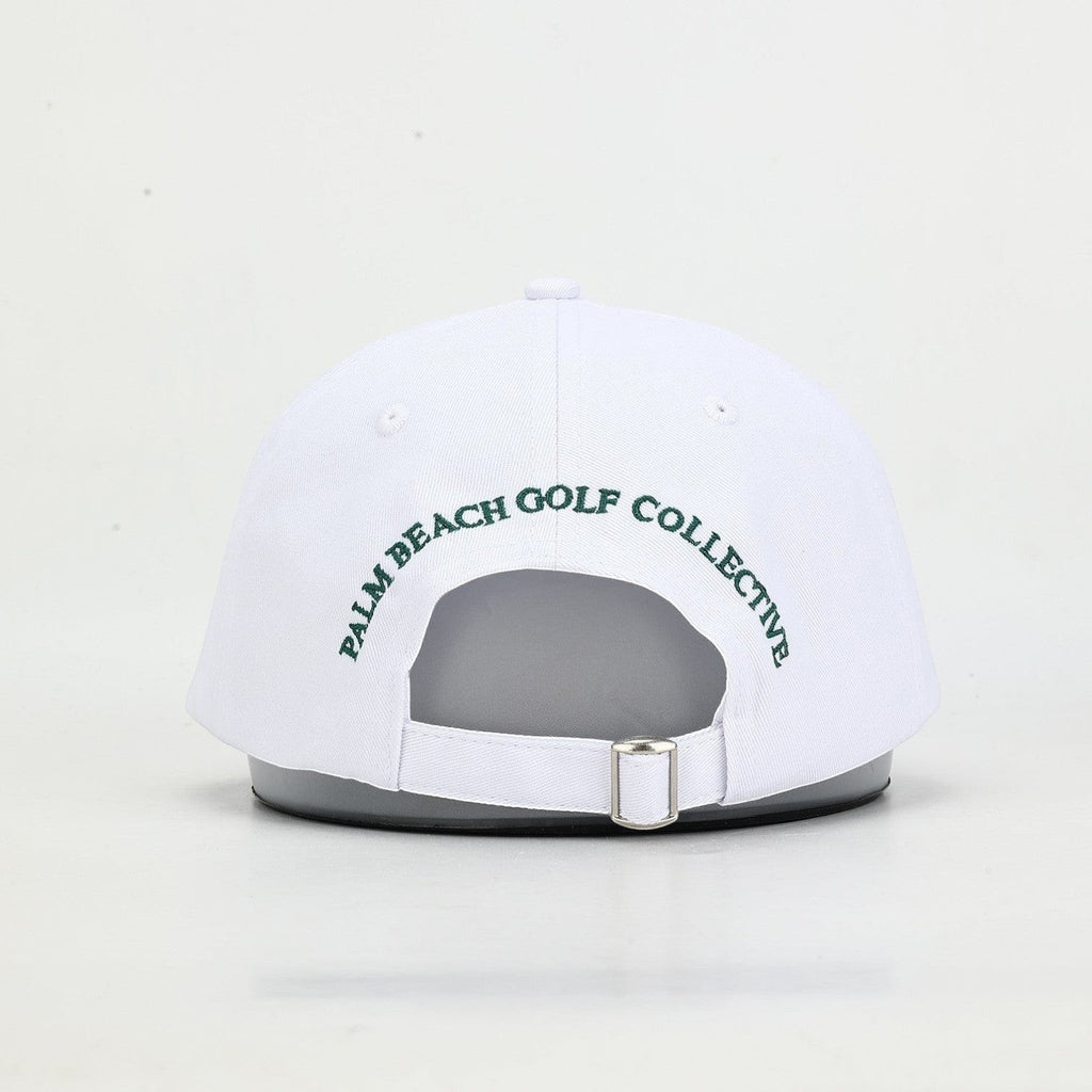 PBGC white cotton twill baseball cap with green embroidered text on the back and an adjustable metal strap