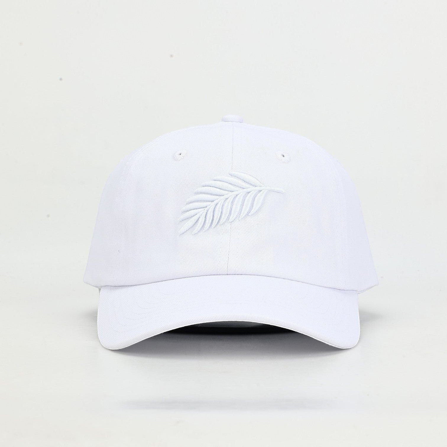 PBGC white cotton twill baseball cap featuring a tonal embroidered fern leaf detail on the front