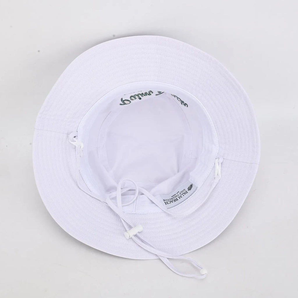 PBGC white bucket hat with adjustable chin strap and green embroidery, viewed from the inside.