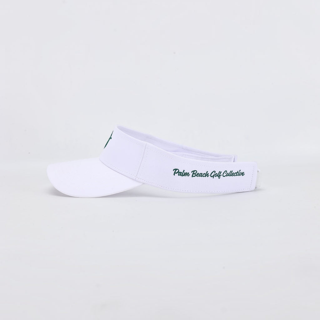 PBGC The Island Visor in white with green embroidered branding on the side, designed for golf and sunny days.