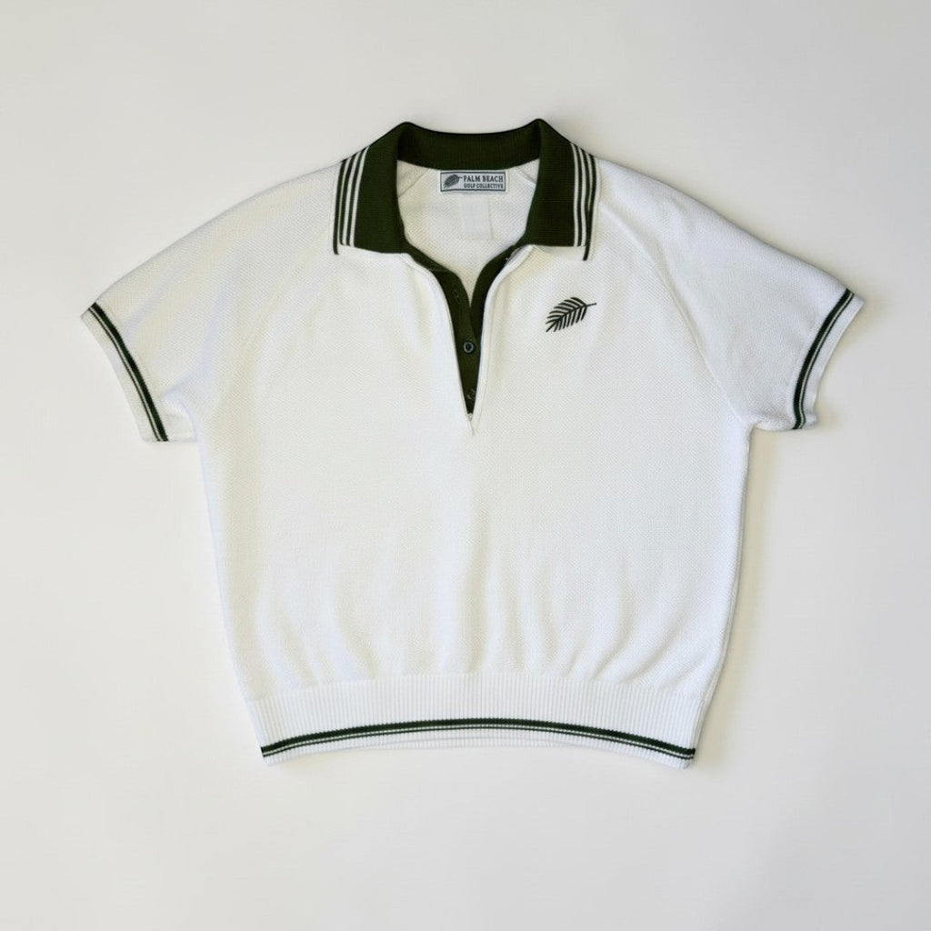 PBGC white short-sleeve knit sweater top with dark green quarter-zip collar, contrast trim, and palm logo embroidery.