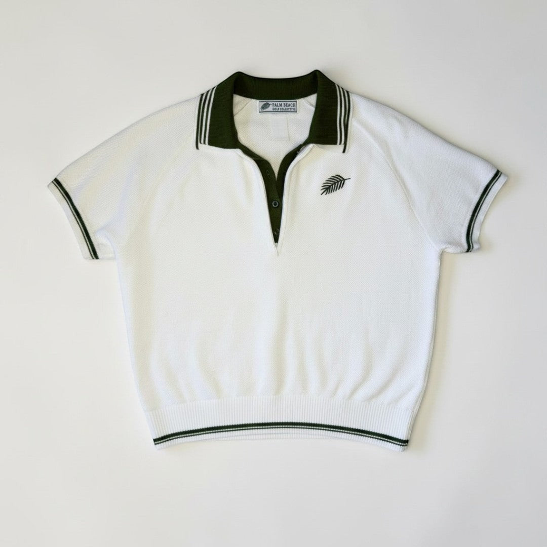 PBGC white short-sleeve knit sweater top with dark green quarter-zip collar, contrast trim, and palm logo embroidery.