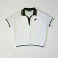 PBGC white knit polo sweater with olive green collar, placket, and palm leaf embroidery on a neutral background.